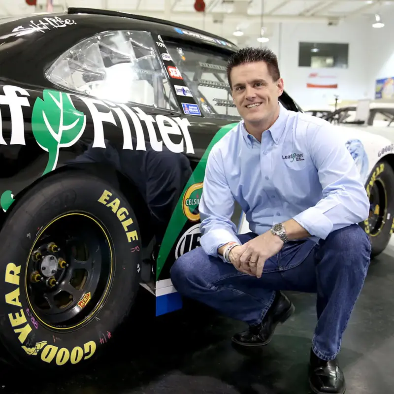 Matt Kaulig poses with the LeafFilter-branded number 8 Chevrolet NASCAR