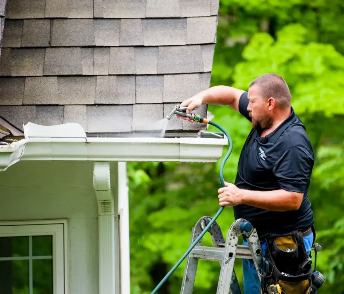 Mathew installing leaffilter on customers gutter