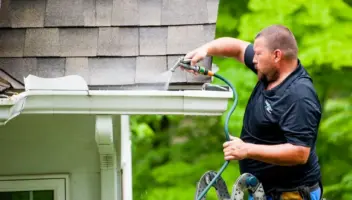 Mathew installing leaffilter on customers gutter