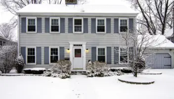 Exterior house snow on roof and lawn after winterize your home.