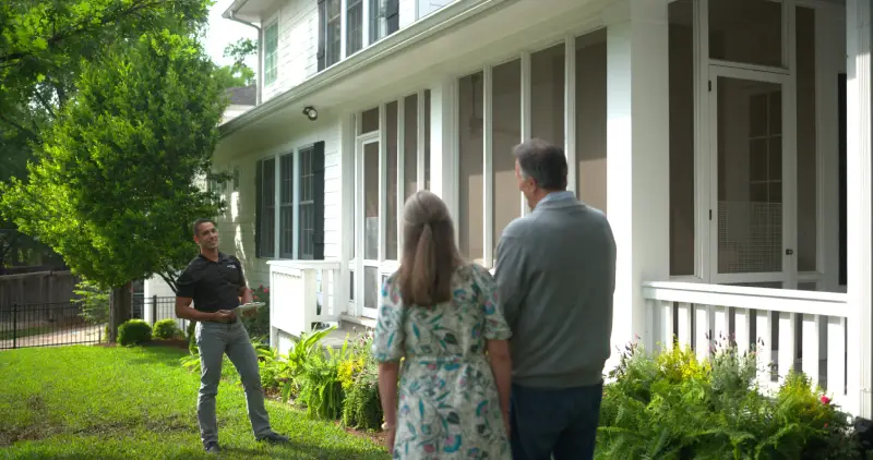 Family in front of house