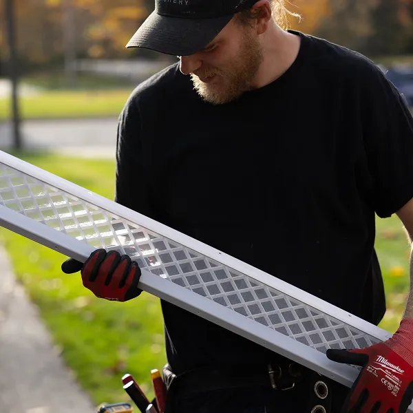 LeafFilter installer holding LeafFilter gutter guard