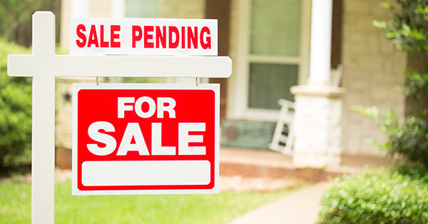 Sale pending sign on a home with contingencies